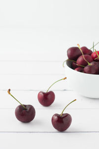 Close-up of apples in bowl against white background