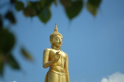 Low angle view of statue against sky