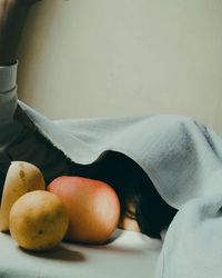 Close-up of apple on table at home