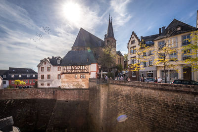 Buildings in city against sky