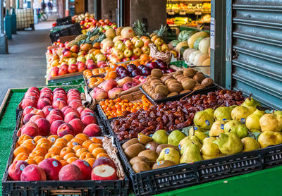 Various fruits on display at market stall