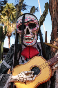 Flower and skeleton alter at dia de los muertos, day of the dead.