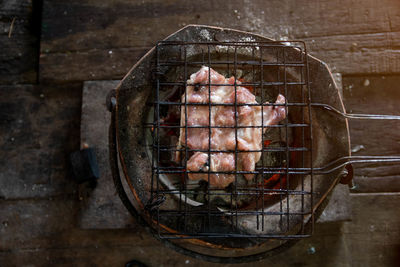 High angle view of meat on barbecue grill