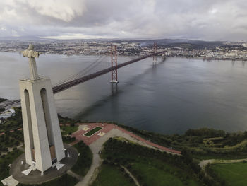 High angle view of bridge over river against cloudy sky