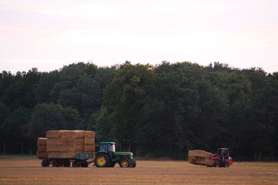 Tractor on field against sky