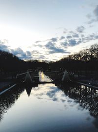 Scenic view of lake against sky during winter