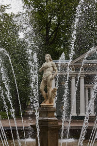 Low angle view of fountain in city