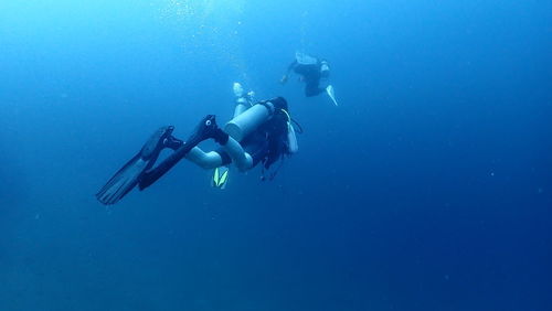 People swimming in sea