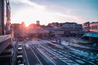 Traffic on city street against sky