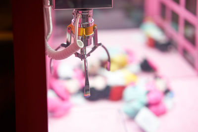 Close-up of toy hanging on metal