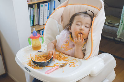 High angle view of woman with food on table