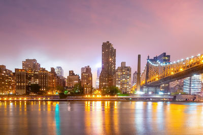 Illuminated city at waterfront