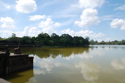 Scenic view of lake against cloudy sky