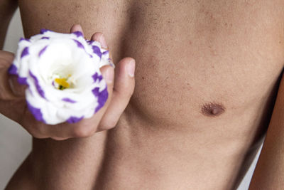 Close-up of shirtless man hand