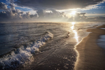 Sun over beach on baltic sea