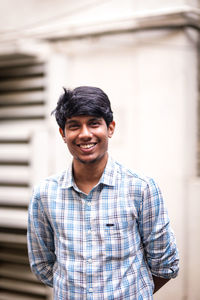 Portrait of young man standing outdoors