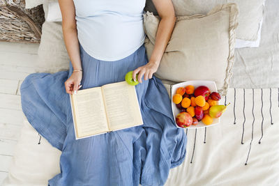 Midsection of woman holding ice cream