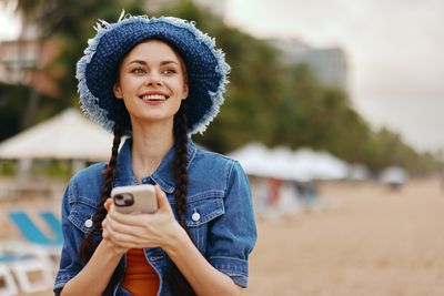 Young woman using mobile phone