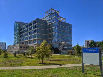 View of modern building against blue sky