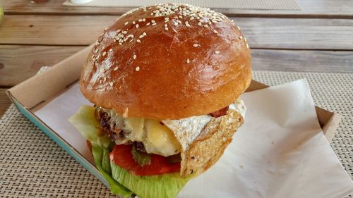 High angle view of burger on wooden table