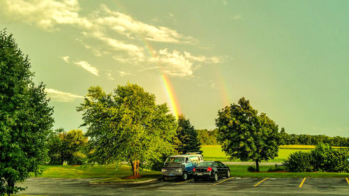 Cars on road against sky