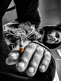 Close-up of man holding camera