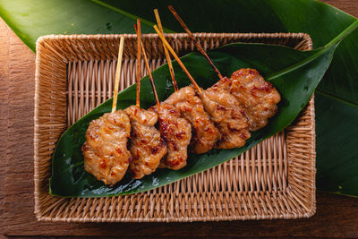 High angle view of meat on barbecue grill