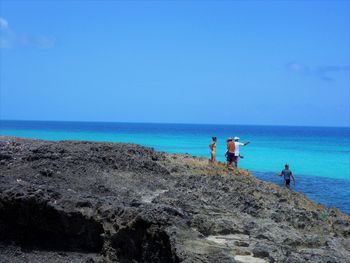 Scenic view of sea against clear blue sky