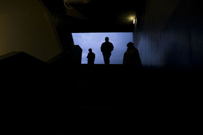 Silhouette people standing on staircase