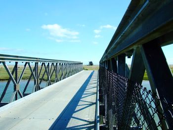 Footbridge against sky