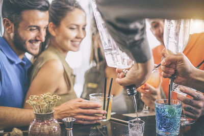 Group of people in a drinking glass