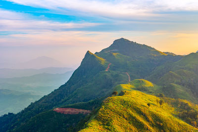Scenic view of mountains against sky during sunset