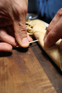 Midsection of person preparing food on table