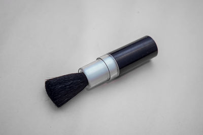 High angle view of pen on table against white background