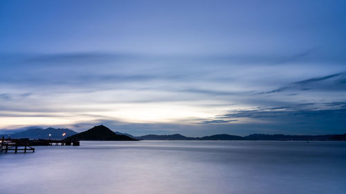 Scenic view of sea against sky at sunset