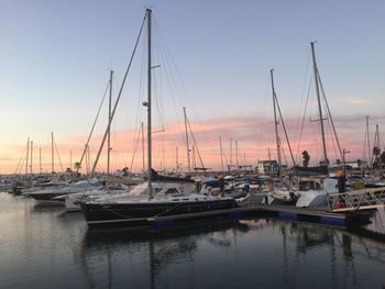 Boats moored at harbor