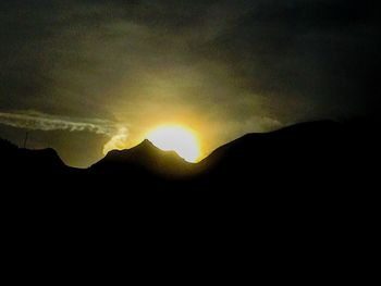 Scenic view of mountains against sky during sunset