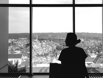 Woman looking at cityscape