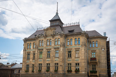 Low angle view of historic building against sky