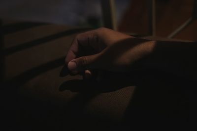 Close-up of hand on shadow