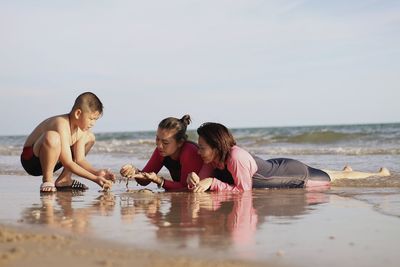 Mother with children at beach