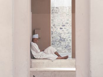 Man sleeping by window