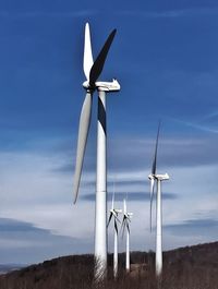 Wind turbines in field