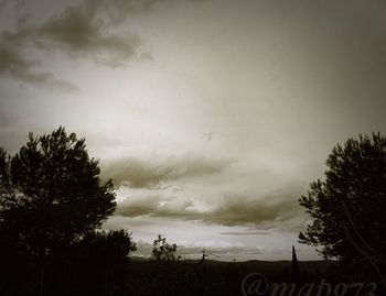 Scenic view of landscape against cloudy sky