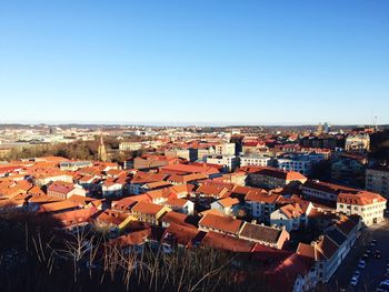 High angle view of cityscape against clear blue sky