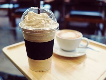 Close-up of cappuccino served on table