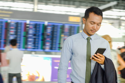 Man using mobile phone in office