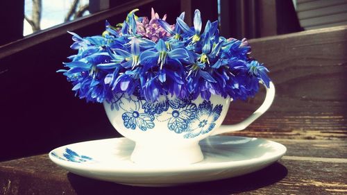 Close-up of flower vase on table