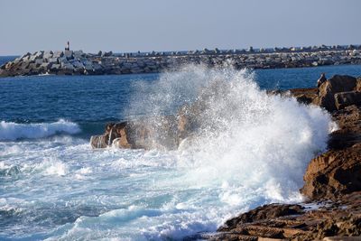 Waves splashing on rocks