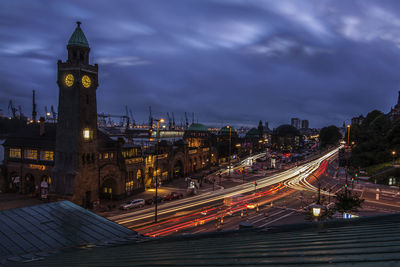 Illuminated city against sky at night
